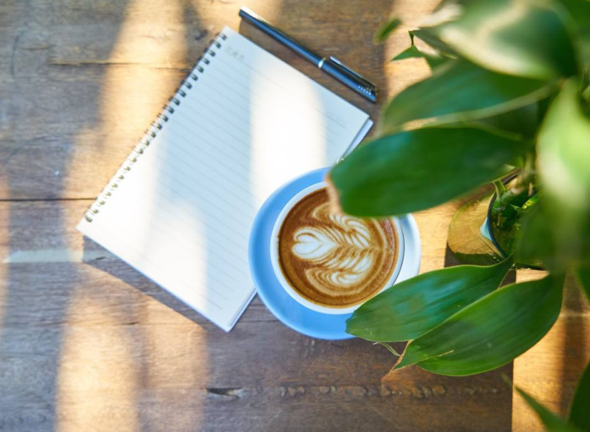 httpswww.pexels.comphotocup-of-latte-beside-spiral-notebook-with-black-pen-459515